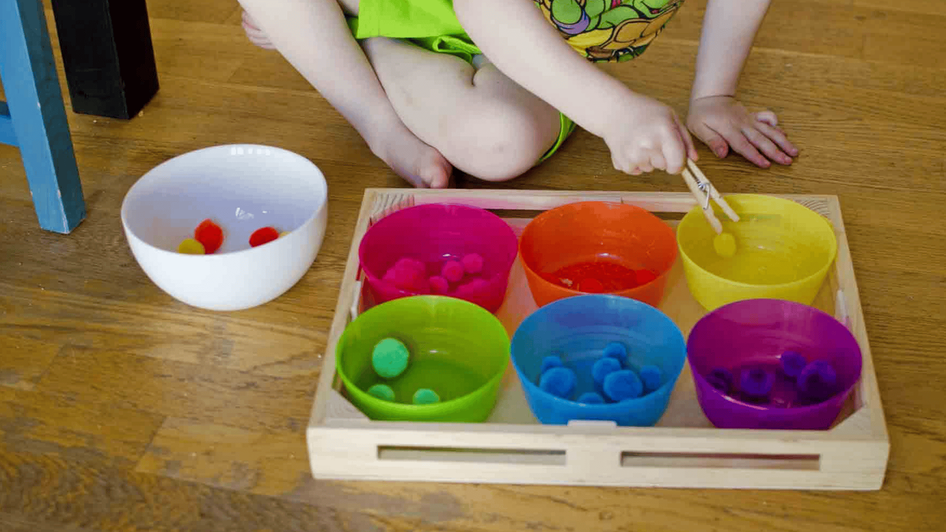 color sorting with pom poms and cups