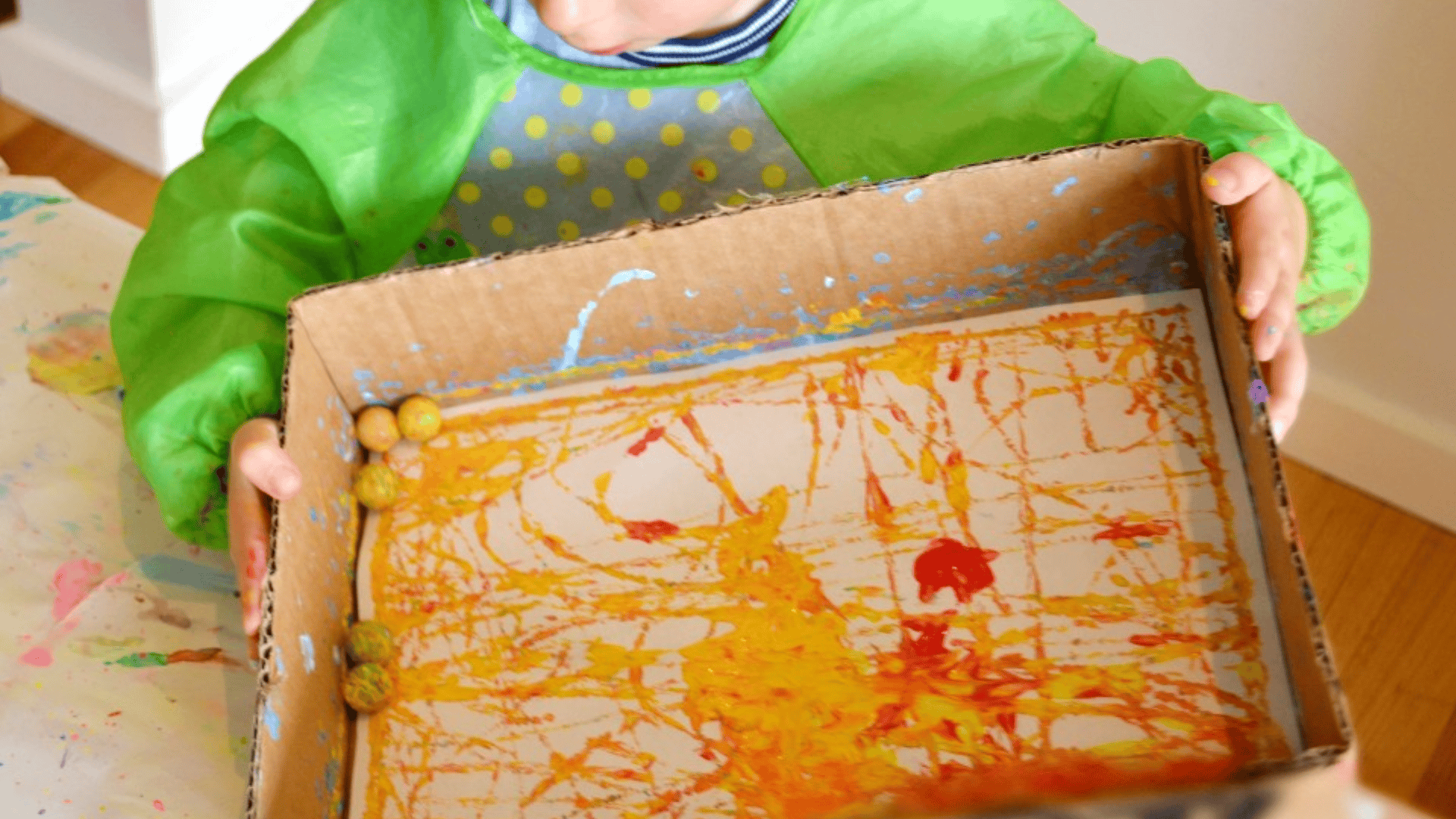 rolling marbles in paint for patterns