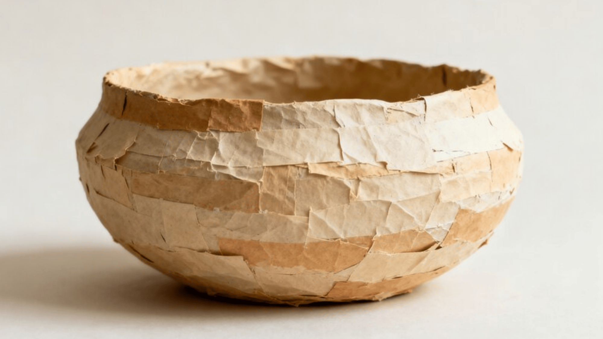 brown colored bowl made with paper mache