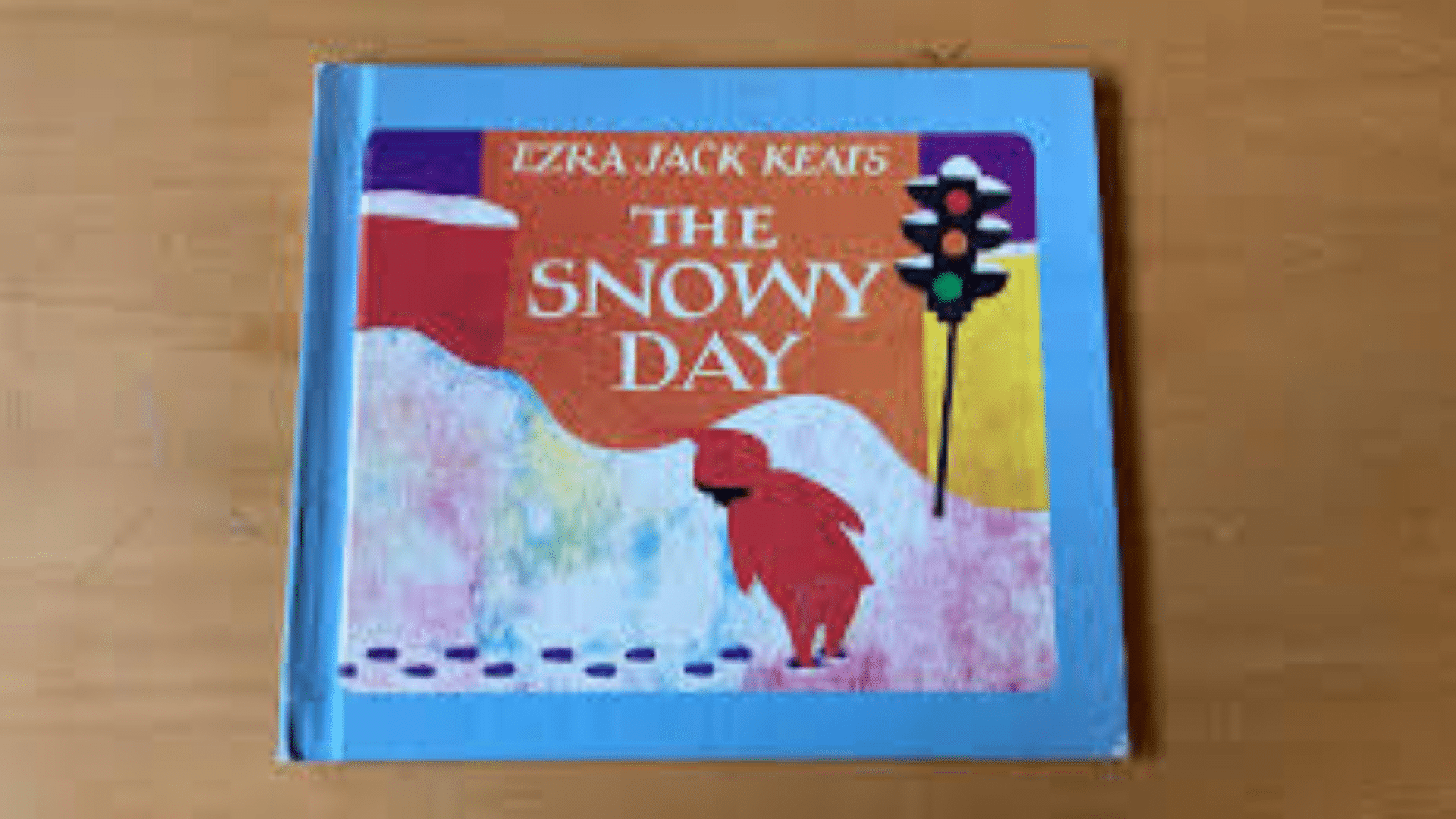 cover of The Snowy Day by Ezra Jack Keats showing a child walking in a snowy city scene