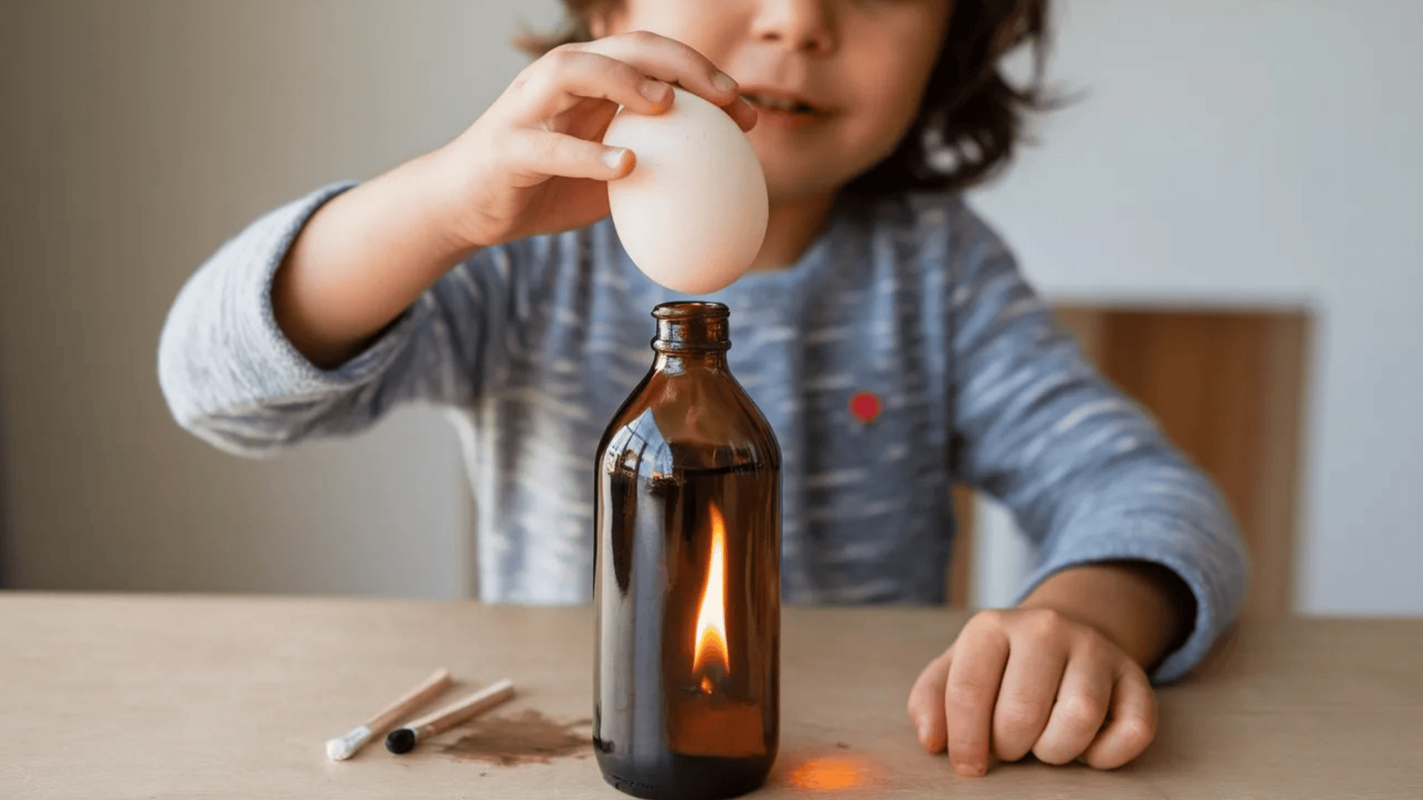 egg being sucked into a bottle