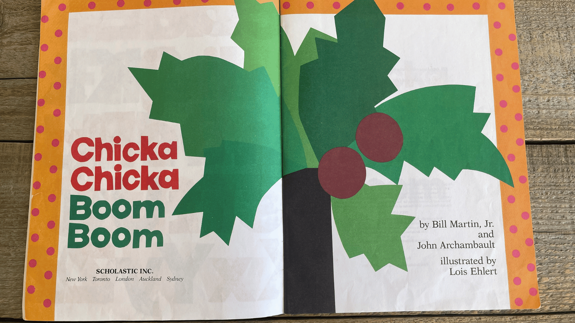 open spread of Chicka Chicka Boom Boom showing a bold palm tree with bright green leaves and playful typography