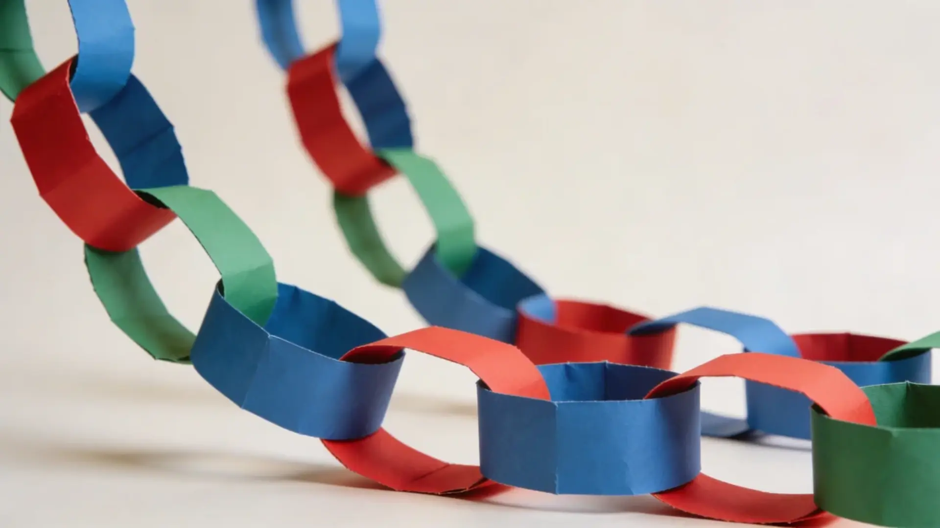 Paper chain made from linked colored strips forming loops