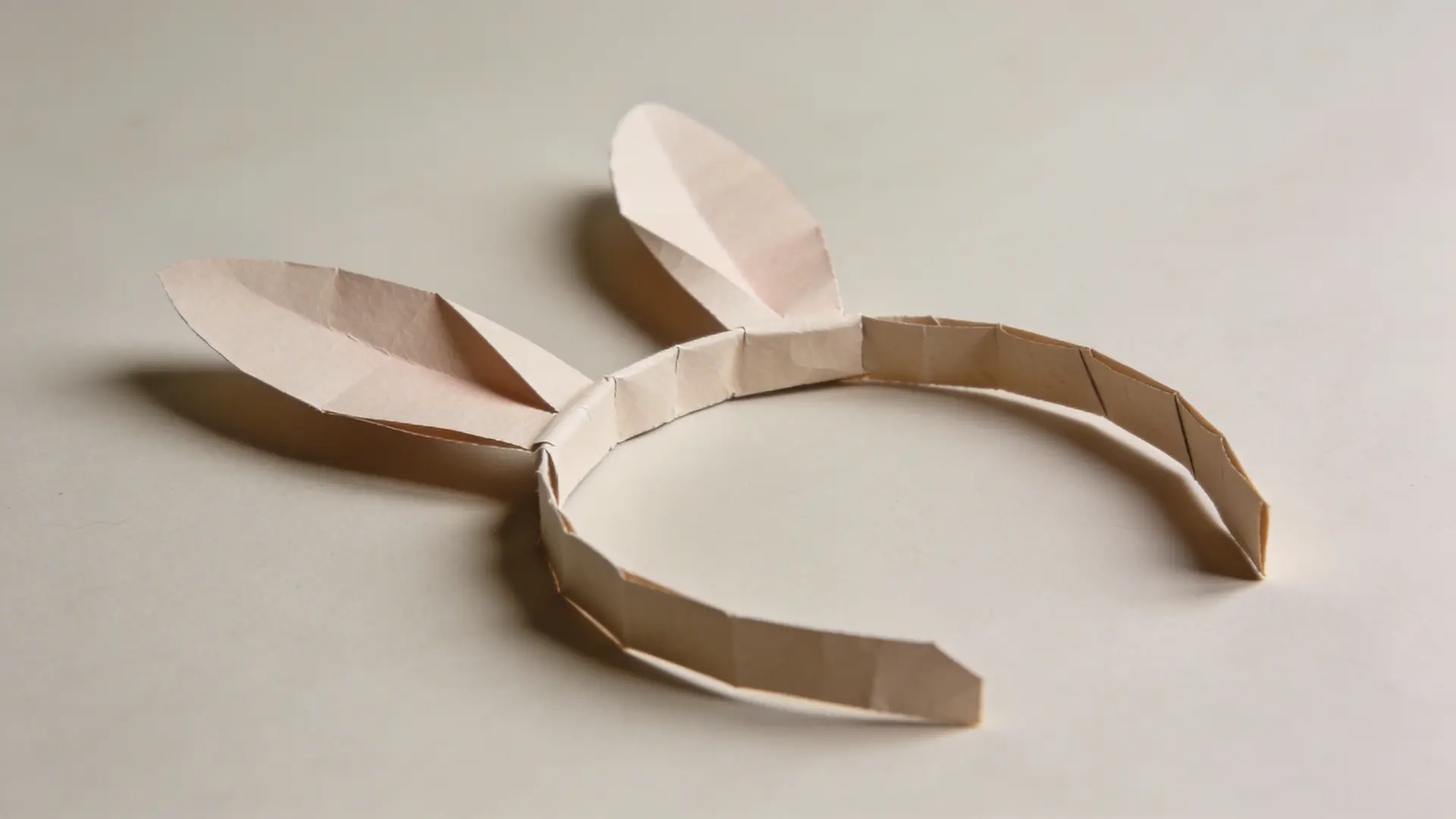 Paper headband with attached bunny ears and inner ear details
