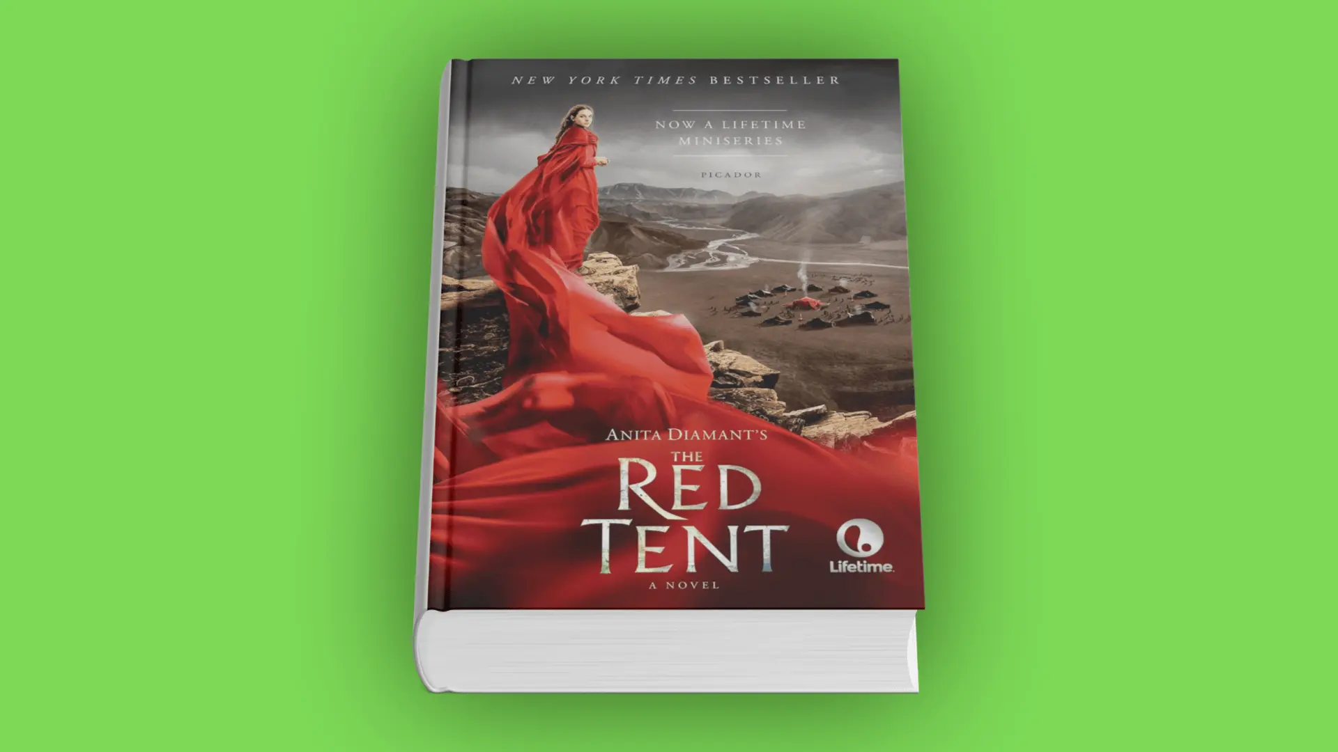 Book cover of The Red Tent by Anita Diamant with a woman in a flowing red cloak overlooking a desert camp