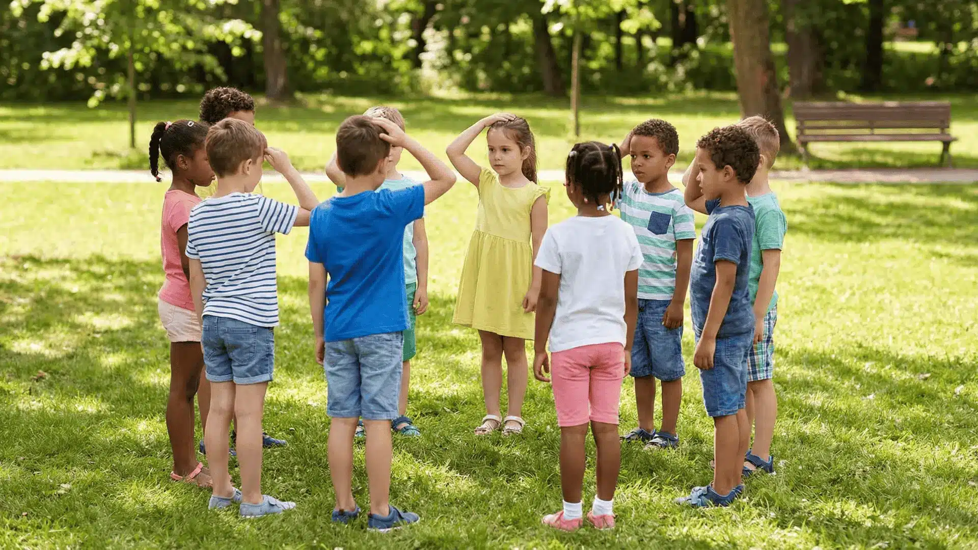 Children in a circle repeating actions in sequence during a group game