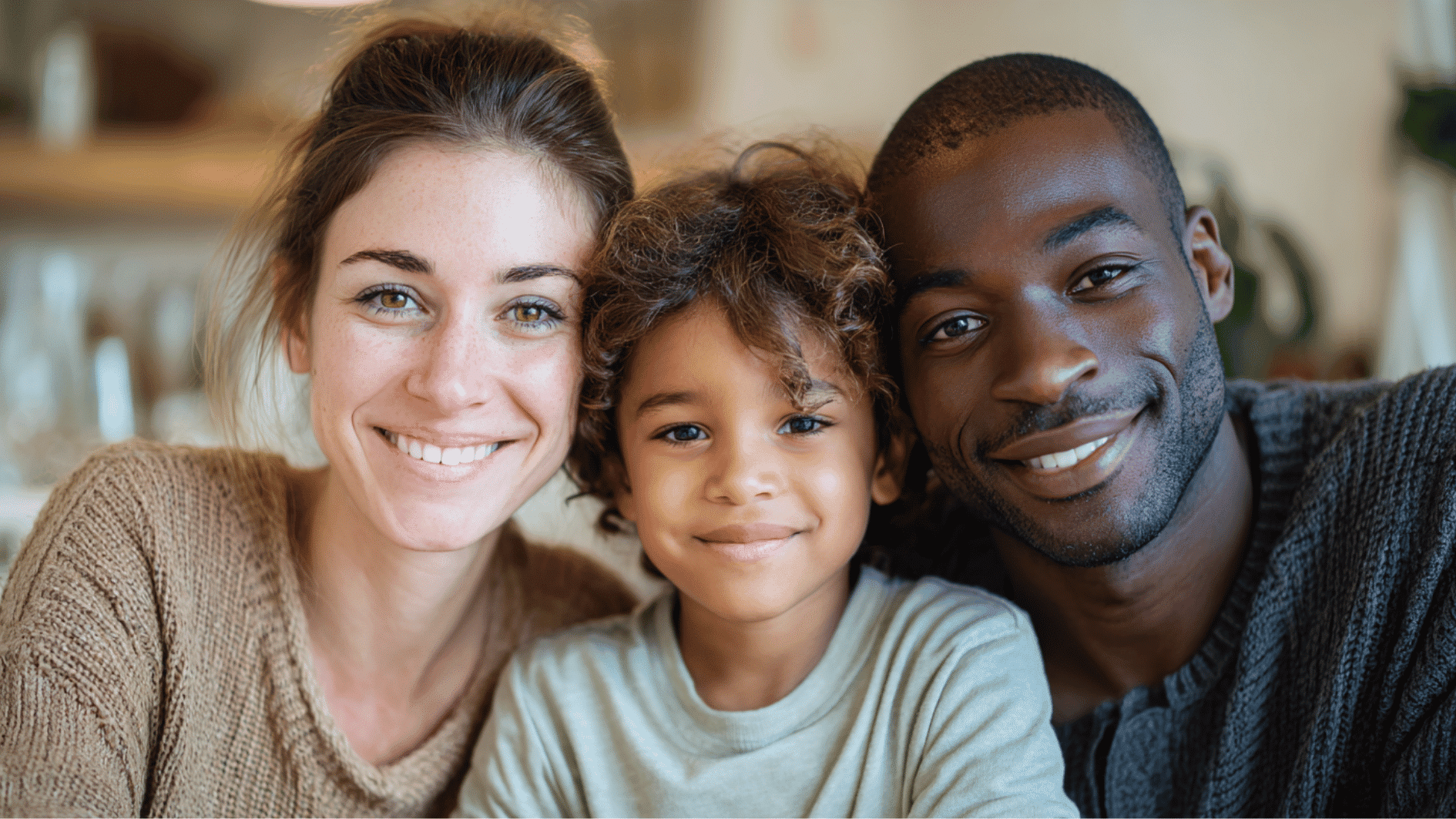 parents and child smiling children sitting together at a homeschool study table inside a bright family home