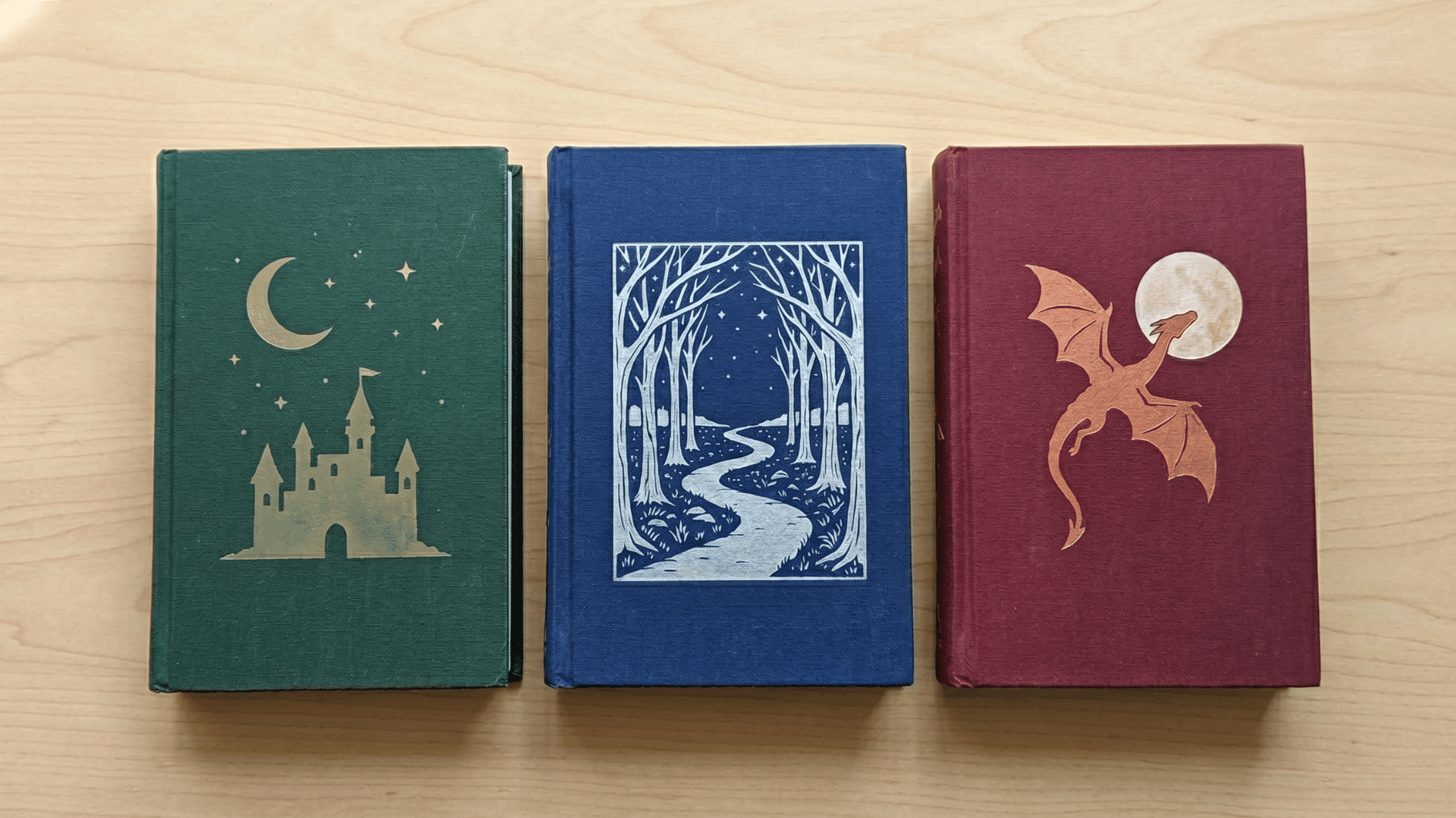 read-aloud book club books with castles, stars, and forest-themed covers on a table