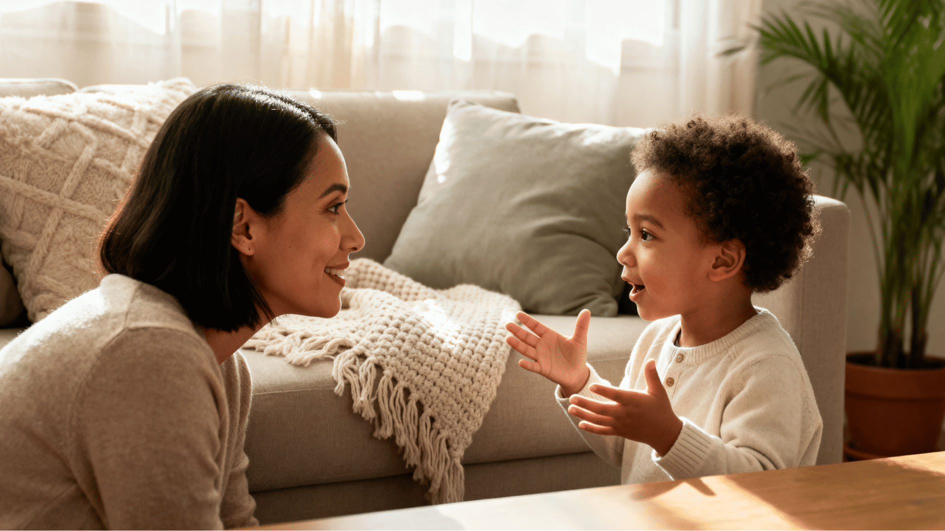 mother listening carefully to young child during a warm conversation in a cozy living room with soft natural sunlight.