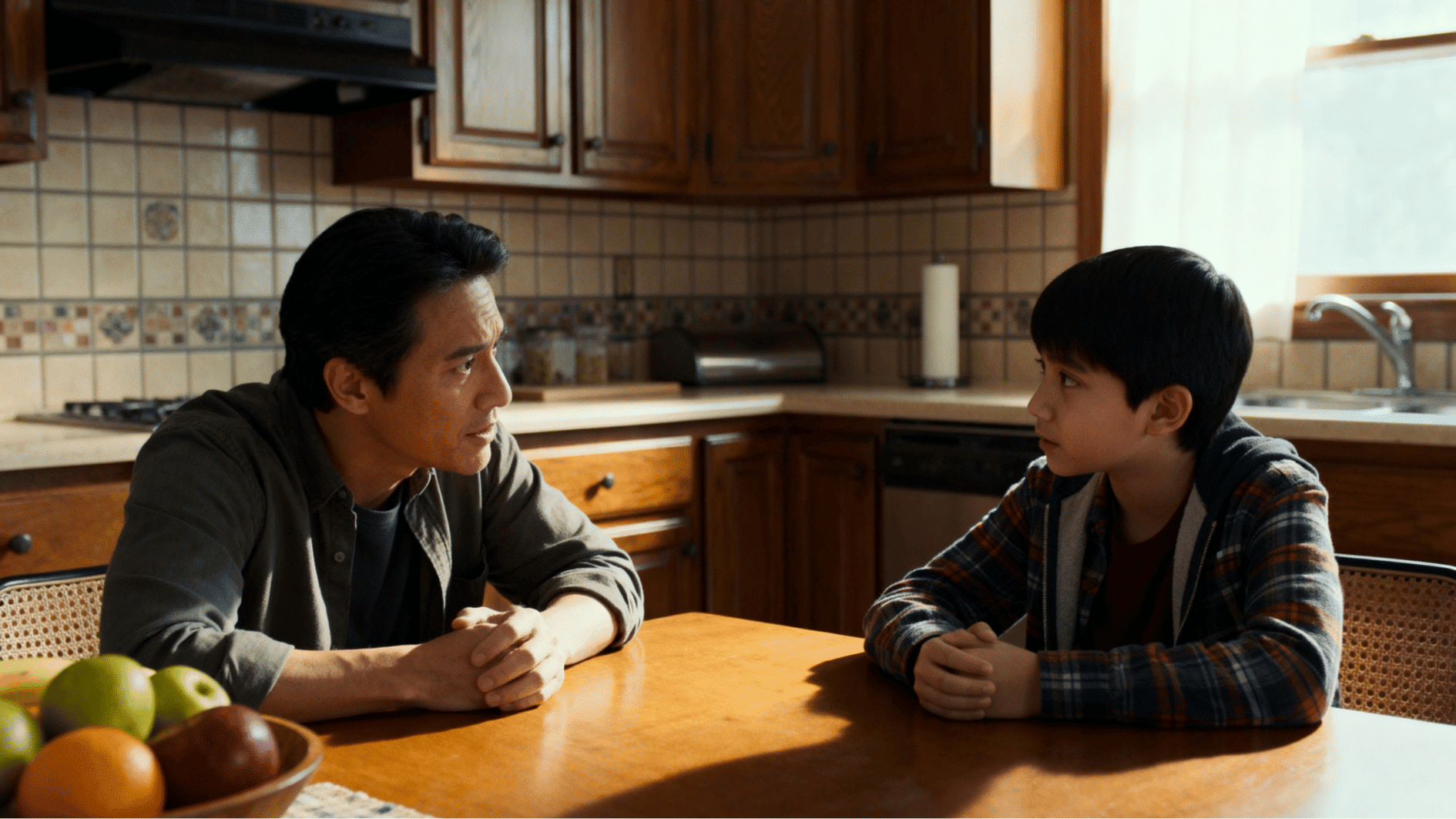 parent calmly discussing mistake with child at kitchen table in a supportive and understanding home environment.
