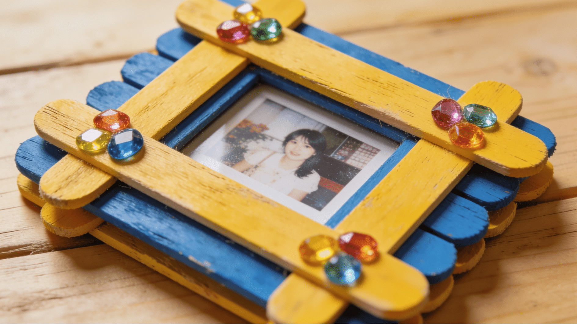 rustic popsicle stick photo frame painted yellow blue with gem decorations fathers day handmade craft for toddlers