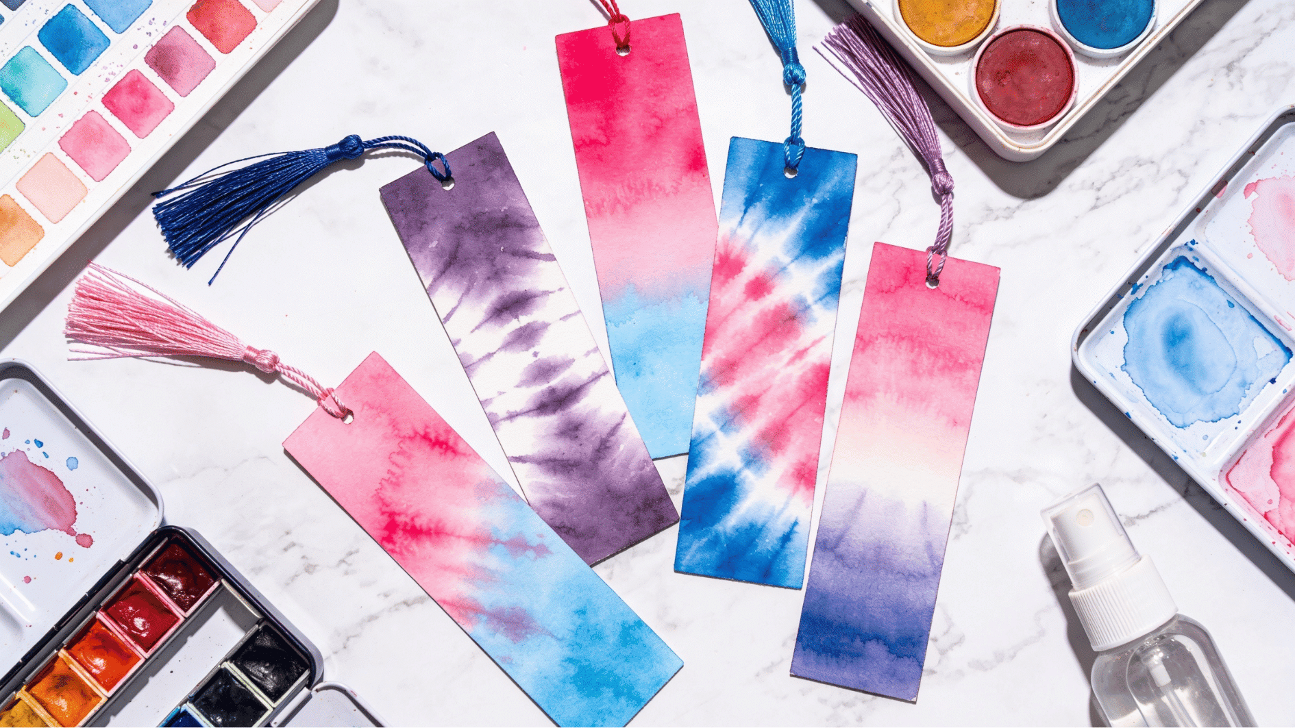 vibrant watercolor tie dye paper bookmarks with ribbon tassels on white marble fathers day craft for kindergarten