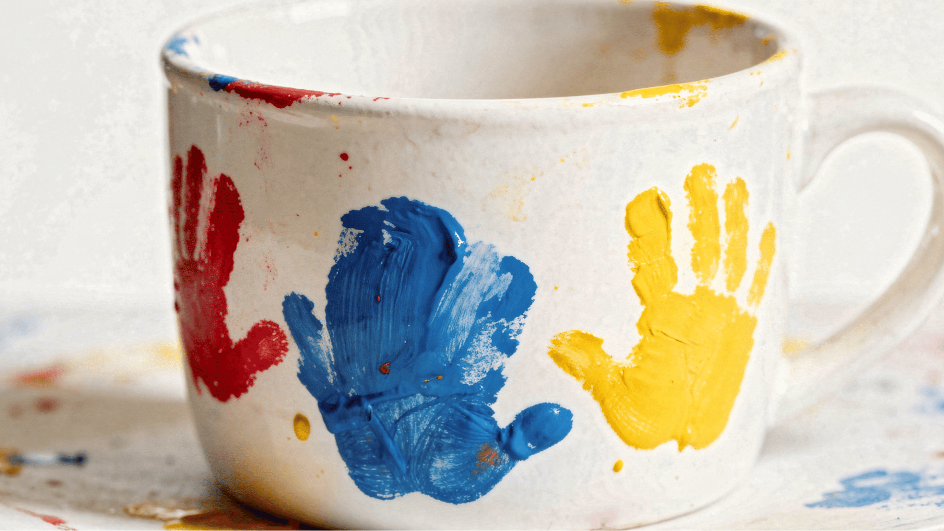 white ceramic mug with colorful toddler fingerprint flowers painted on it fathers day handmade gift idea (1)