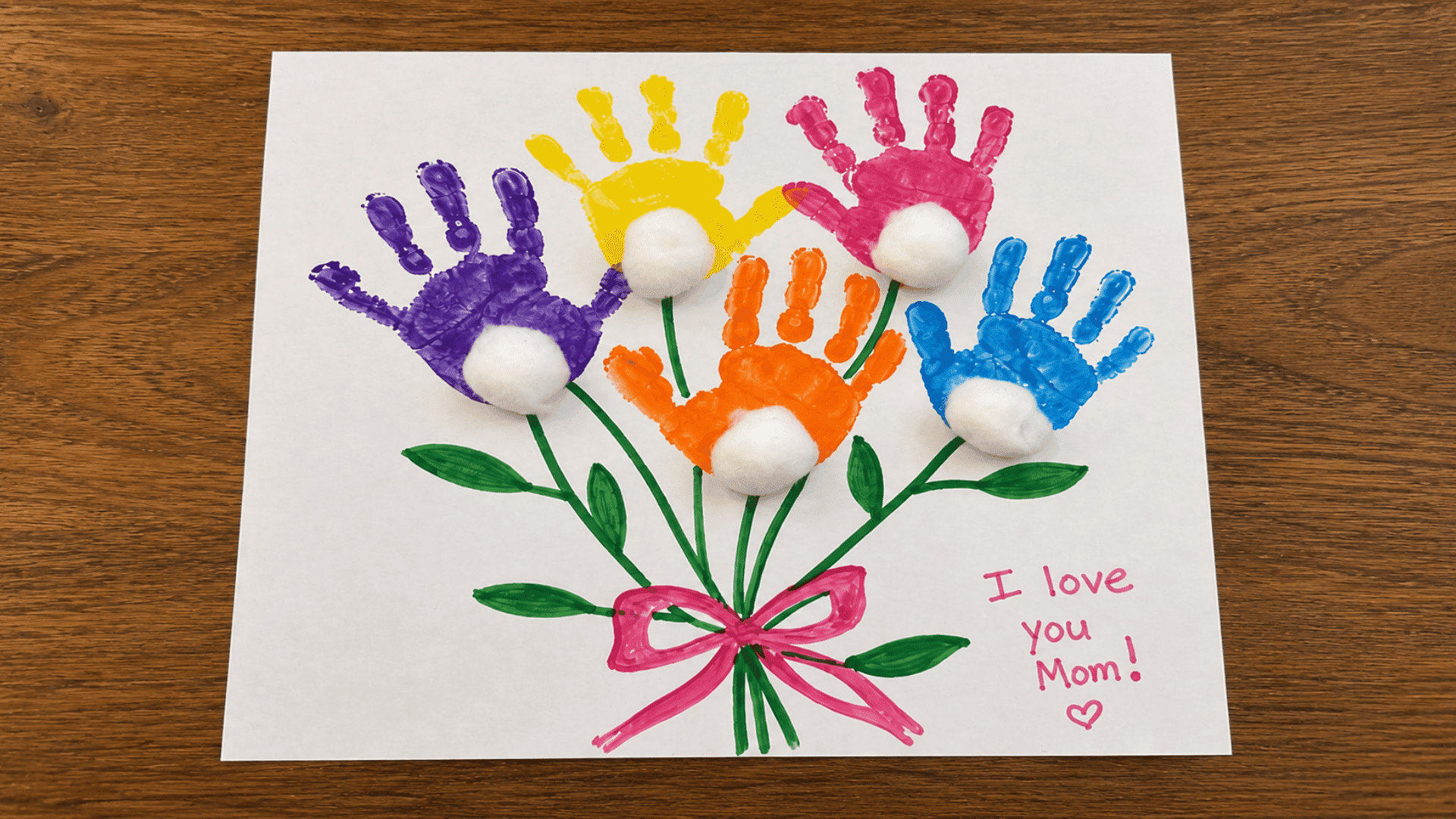 colorful handprint flower bouquet craft with i love you mom written for mother's day