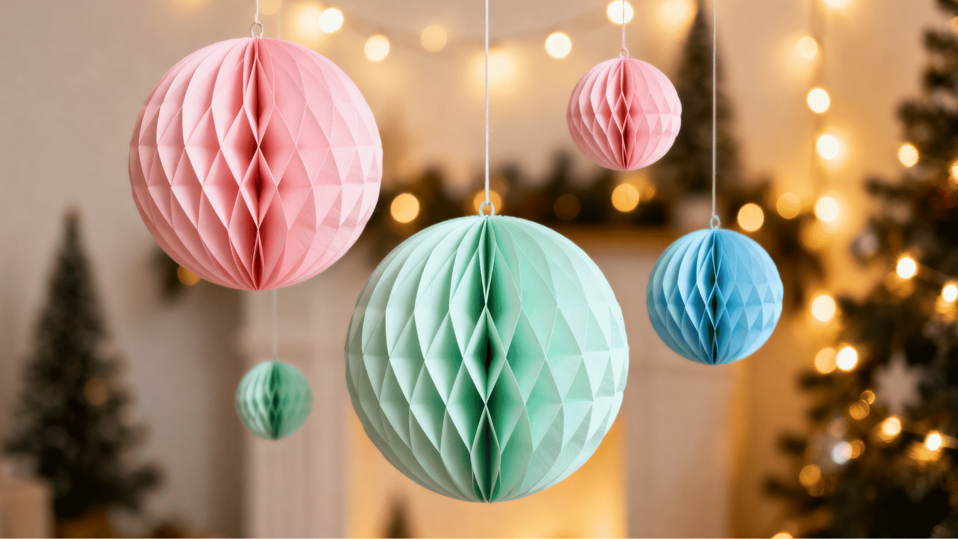 colorful pastel paper honeycomb ornaments hanging in a cozy christmas interior with soft bokeh lights blurred festive background