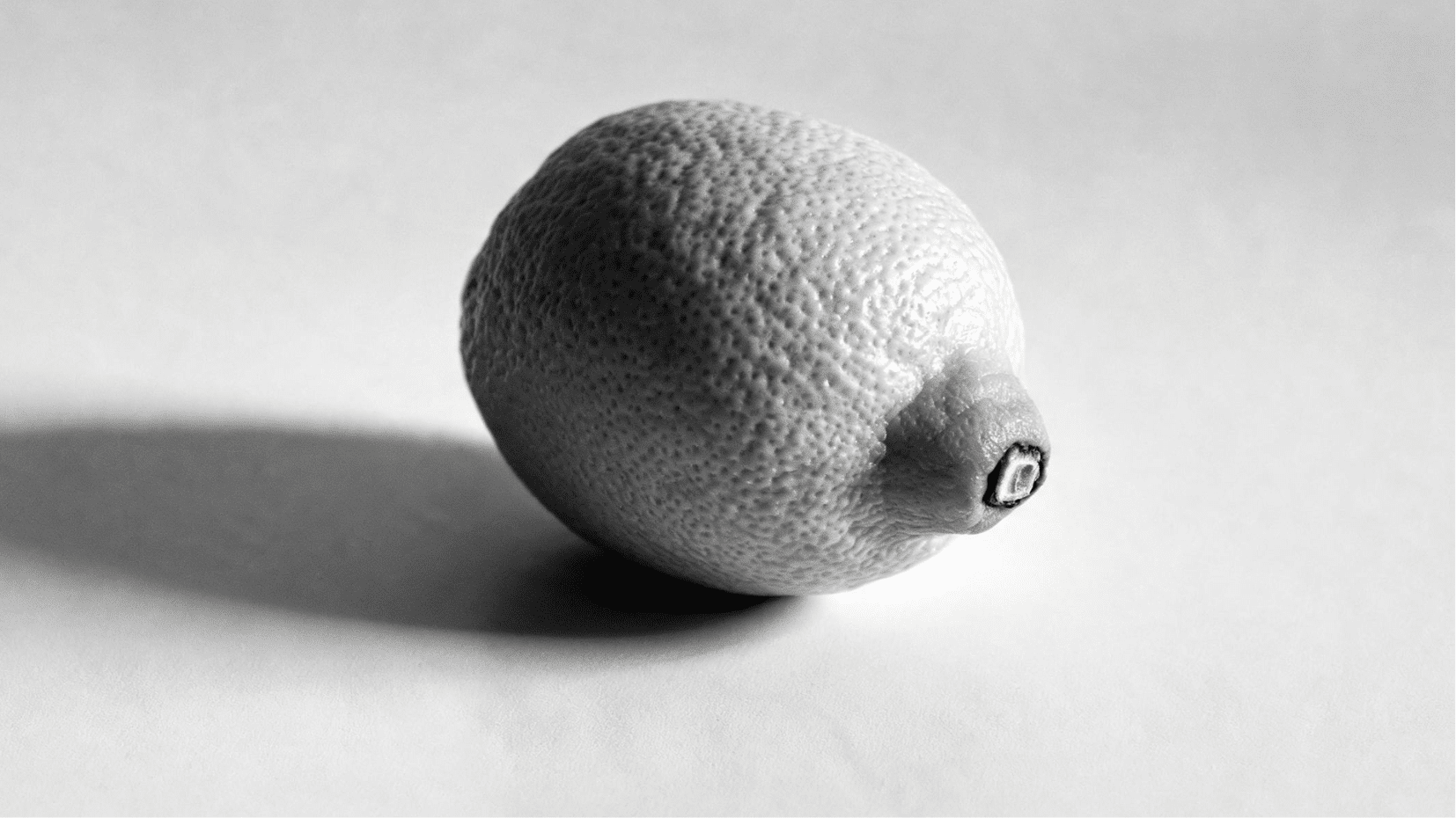 grayscale lemon study showing form, texture, light, and shadow for art practice