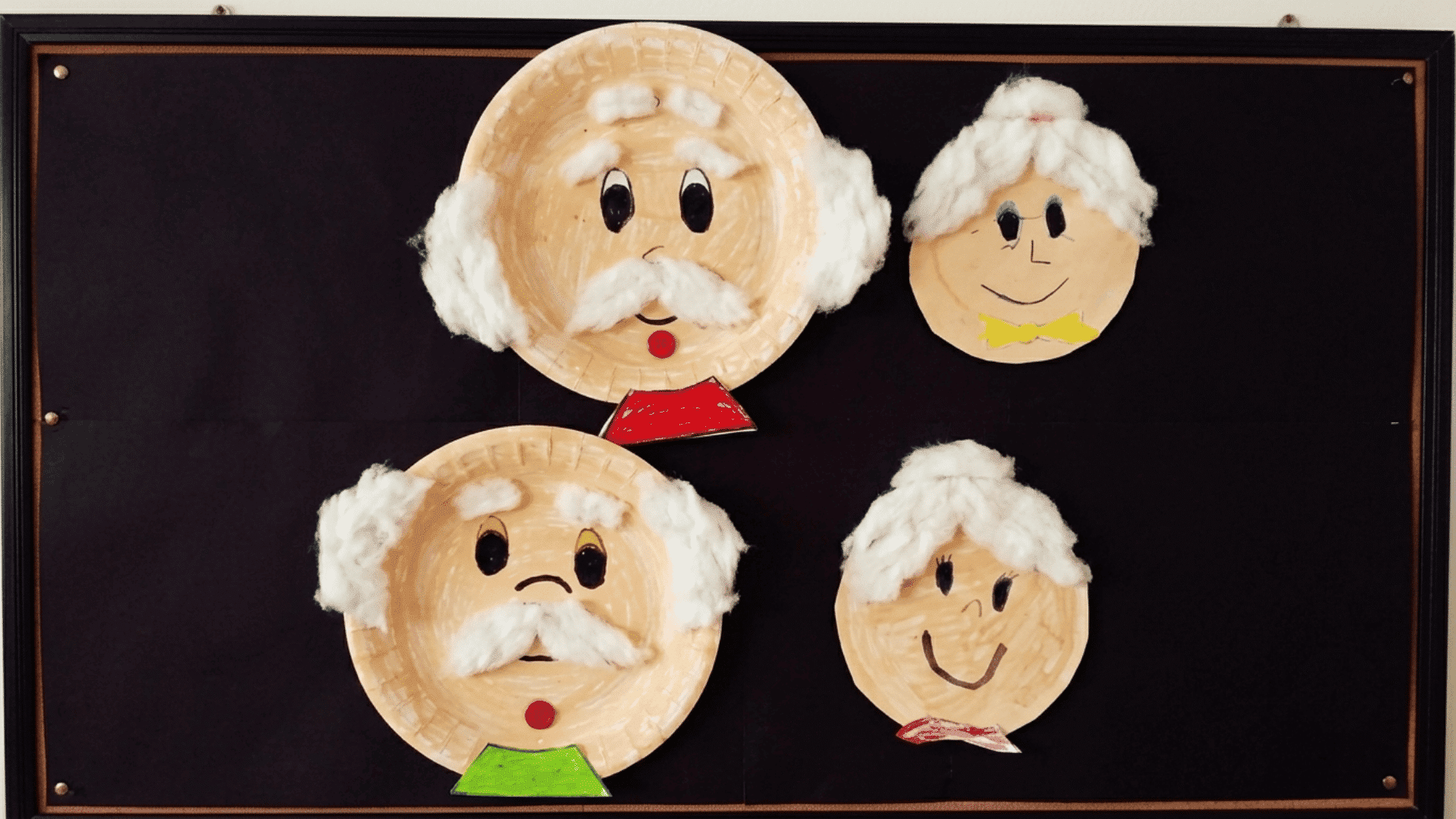 colorful paper plate grandparent portrait with yarn hair glasses and facial features made for grandparents day