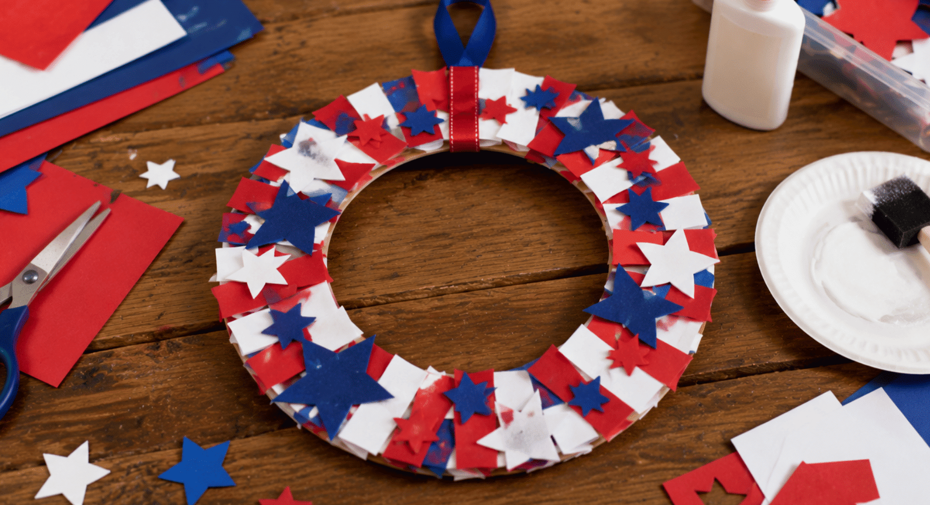 realistic patriotic wreath craft made with paper stars stripes and ribbon