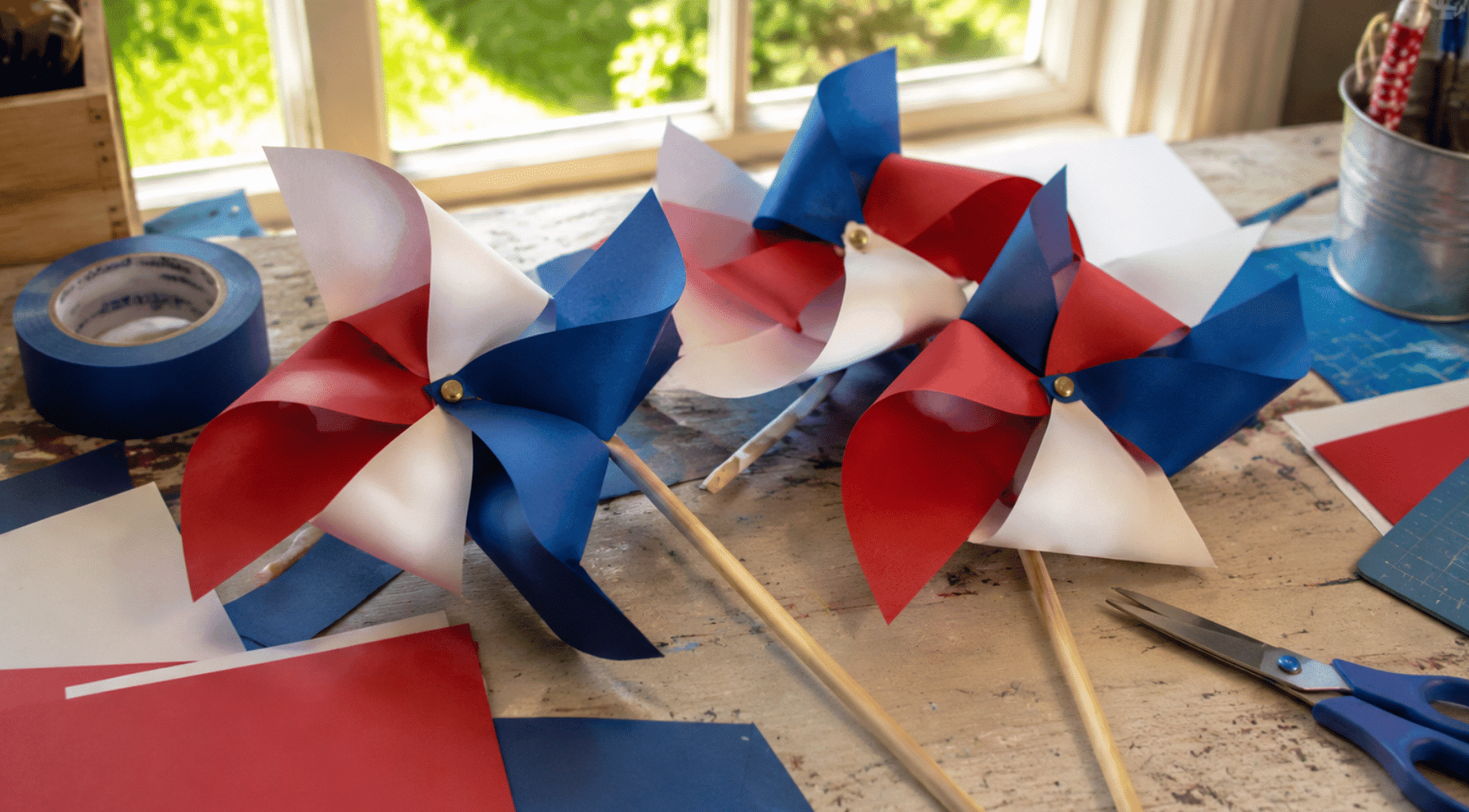 realistic red white and blue pinwheel craft with paper and tools